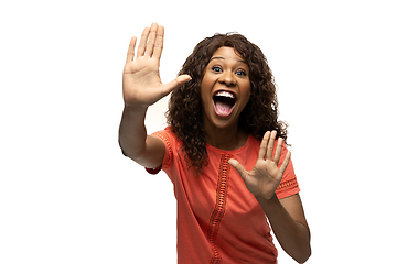 Image showing Young african-american woman with funny, unusual popular emotions and gestures isolated on white studio background