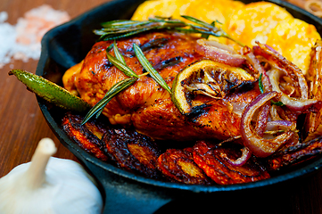 Image showing roasted grilled BBQ chicken breast with herbs and spices