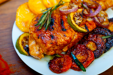 Image showing roasted grilled BBQ chicken breast with herbs and spices