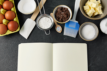 Image showing recipe book and cooking ingredients on table
