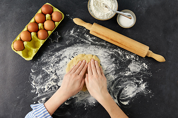 Image showing hands making shortcrust pastry dough on table