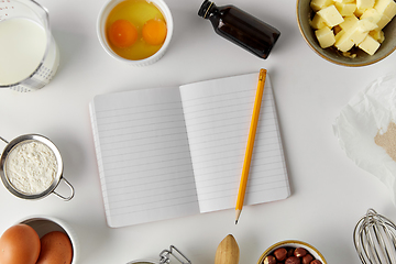 Image showing recipe book and cooking ingredients on table