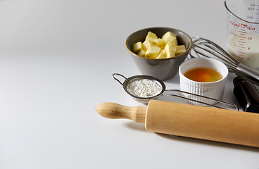 Image showing rolling pin, butter, eggs, flour, milk and whisk