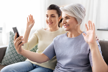 Image showing daughter and old mother having video call on phone