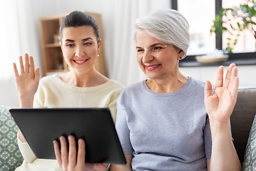 Image showing daughter and mother having video call on tablet pc