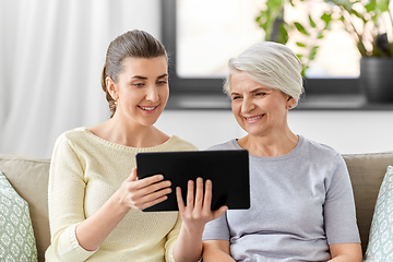 Image showing daughter and senior mother with tablet pc at home