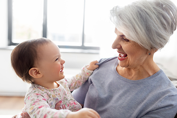 Image showing happy grandmother with baby granddaughter at home