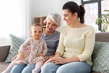 Image showing mother, daughter and grandmother on sofa at home