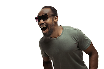 Image showing Young african-american man with funny, unusual popular emotions and gestures isolated on white studio background