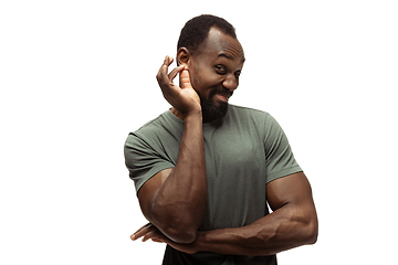 Image showing Young african-american man with funny, unusual popular emotions and gestures isolated on white studio background