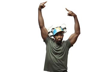 Image showing Young african-american man with funny, unusual popular emotions and gestures isolated on white studio background