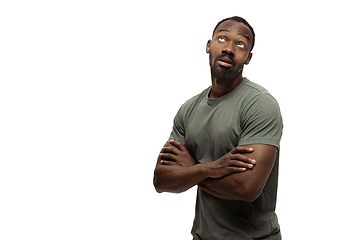 Image showing Young african-american man with funny, unusual popular emotions and gestures isolated on white studio background