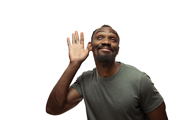 Image showing Young african-american man with funny, unusual popular emotions and gestures isolated on white studio background