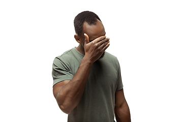 Image showing Young african-american man with funny, unusual popular emotions and gestures isolated on white studio background