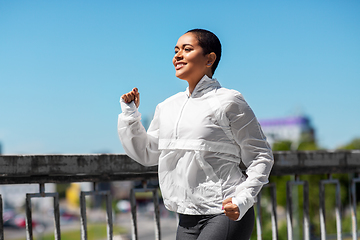 Image showing african american woman running outdoors