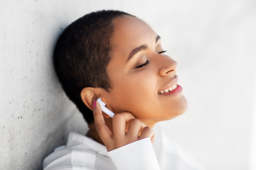 Image showing happy african american woman with earphones