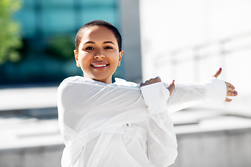 Image showing african american woman doing sports outdoors