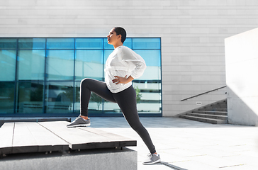 Image showing african american woman doing sports outdoors