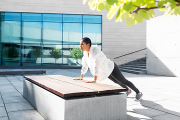 Image showing african american woman doing sports outdoors