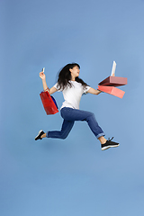 Image showing Portrait of young asian woman isolated on blue studio background