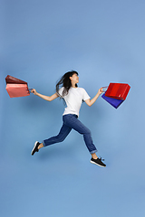 Image showing Portrait of young asian woman isolated on blue studio background