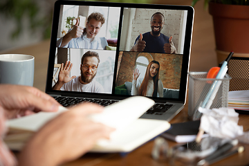 Image showing Remote meeting. Man working from home during coronavirus or COVID-19 quarantine, remote office concept.