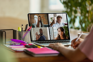 Image showing Remote meeting. Woman working from home during coronavirus or COVID-19 quarantine, remote office concept.