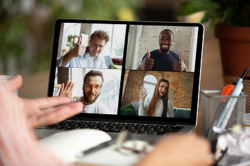 Image showing Remote meeting. Man working from home during coronavirus or COVID-19 quarantine, remote office concept.