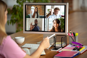 Image showing Remote meeting. Woman working from home during coronavirus or COVID-19 quarantine, remote office concept.