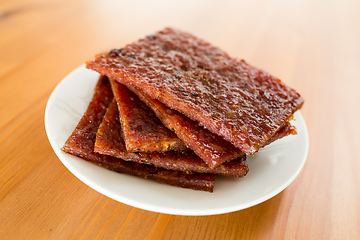Image showing Sliced dried pork on dish