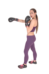 Image showing Slim woman in workout outfit boxing