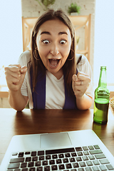 Image showing Excited football fan watching sport match at home, remote support of favourite team during coronavirus pandemic outbreak