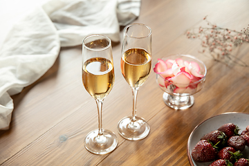 Image showing Glasses of sparkling champagne, close up. Warm colored. Celebration event, holidays, drinks concept