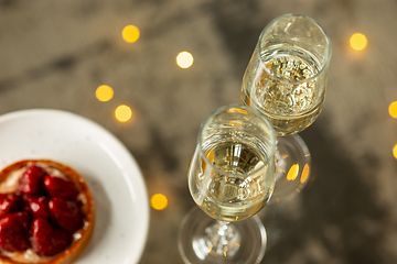 Image showing Glasses of sparkling champagne, close up. Warm colored. Celebration event, holidays, drinks concept