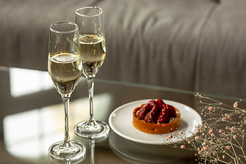 Image showing Glasses of sparkling champagne, close up. Warm colored. Celebration event, holidays, drinks concept