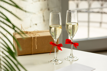 Image showing Glasses of sparkling champagne, close up. Warm colored. Celebration event, holidays, drinks concept