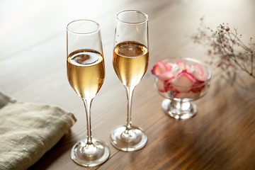 Image showing Glasses of sparkling champagne, close up. Warm colored. Celebration event, holidays, drinks concept