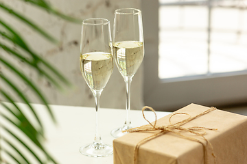 Image showing Glasses of sparkling champagne, close up. Warm colored. Celebration event, holidays, drinks concept