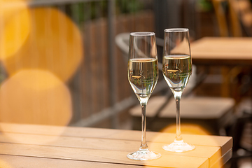 Image showing Glasses of sparkling champagne, close up. Warm colored. Celebration event, holidays, drinks concept