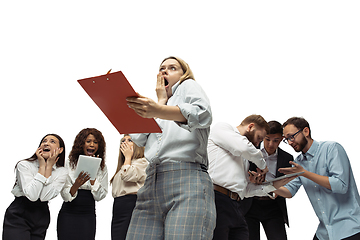 Image showing Nervous tensioned investors analyzing crisis stock market with charts on screen of their gadgets