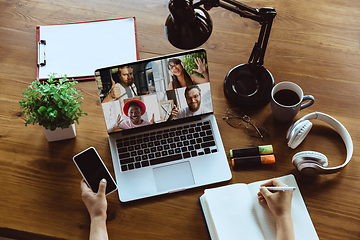 Image showing Remote meeting. Woman working from home during coronavirus or COVID-19 quarantine, remote office concept.