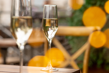 Image showing Glasses of sparkling champagne, close up. Warm colored. Celebration event, holidays, drinks concept