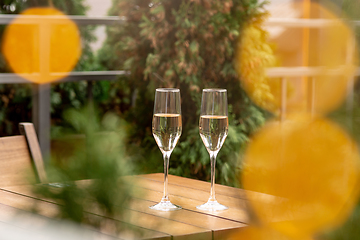 Image showing Glasses of sparkling champagne, close up. Warm colored. Celebration event, holidays, drinks concept