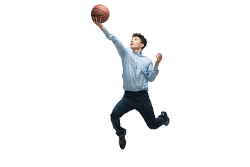 Image showing Man in office clothes playing basketball on white background. Unusual look for businessman in motion, action. Sport, healthy lifestyle.