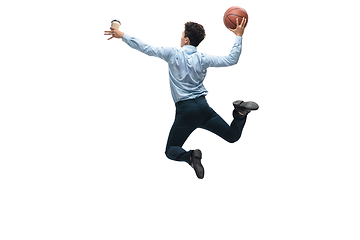 Image showing Man in office clothes playing basketball on white background. Unusual look for businessman in motion, action. Sport, healthy lifestyle.