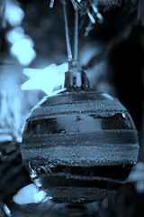 Image showing Christmas ornaments on tree.