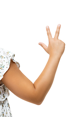 Image showing Children\'s hand, palm gesturing isolated on white studio background