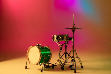 Image showing Drum kit or set isolated on multicolored background in neon light