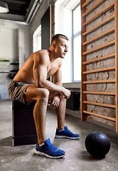 Image showing young man with medicine ball in gym