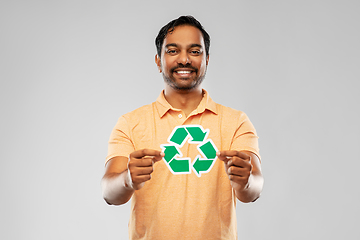 Image showing smiling indian man holding green recycling sign